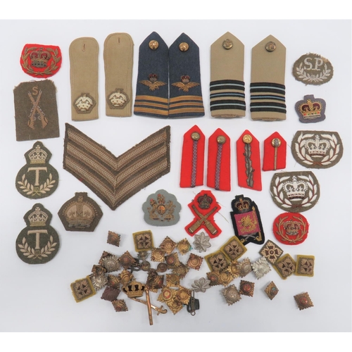 British Rank Insignia
including pair bullion embroidery, QC Squadron Leader full dress shoulder straps .. Pair tropical Squadron Leader shoulder straps ... Pair tropical Major's shoulder straps ... Pair Brigadier collar tabs ... General's collar tabs ... Armoured Corps rank stars ... Various rank stars and badges.  Quantity.