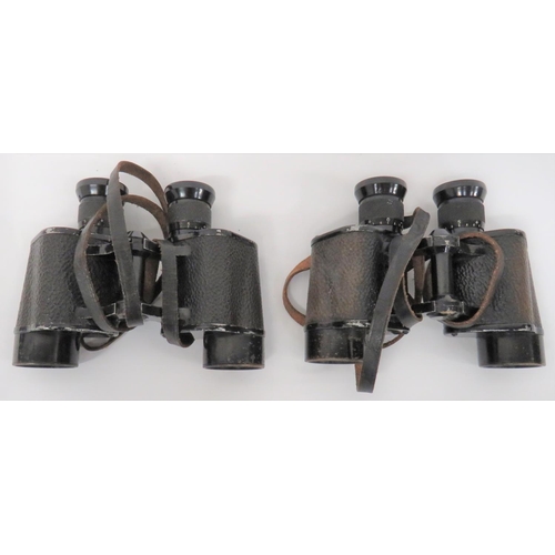 Two Pairs of WW2 RAF Issue Binoculars
black painted brass and alloy frames with crinkle covered bodies.  Top composite eye pieces.  Both marked "6E/293" with crowned AM.  Both complete with leather straps.  2 items