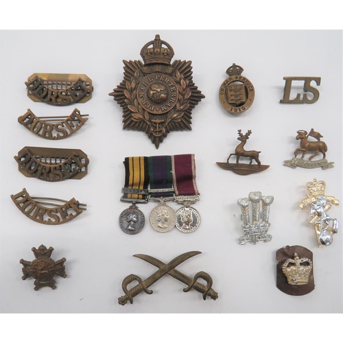 82 - Small Selection of Badges
including brass, KC Royal Marines helmet plate ... 4 x brass Dorset titles... 