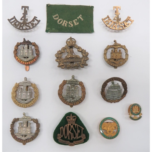 99 - Dorsetshire Cap Badges
including bi-metal 1895-1906 (lugs) ... Brass 4th Batt ... Bi-metal 4th Batt ... 