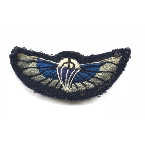 Special Air Service SAS cloth Parachute Qualification Wing of Lt Col W.L. Mundell BEM A rare attributed embroidered padded example. The black cloth backing with two male press studs. Width approx 2 3/4 inches. Has been worn GC 