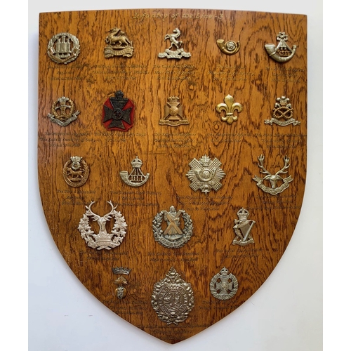 106 - 20 Infantry cap badges mounted on shield.   Good selection beautifully mounted on varnished wooden s... 