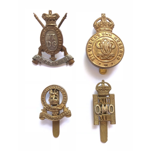 4 Cavalry badges.   Victorian 6th DG (carbine barrels replaced (loops) ... 7th QO Hussars 1916 brass economy (slider) ... 14th/20th Kings Hussars - small (slider) ... 13th/18th Hussars (OMO pattern on slider). (4 items)