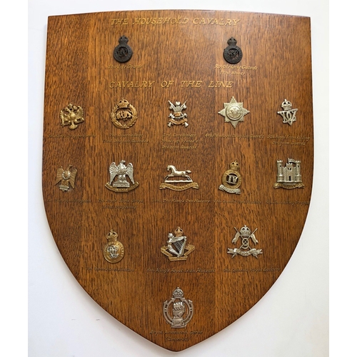 99 - 16 Cavalry cap badges mounted on shield.   Good selection beautifully mounted on varnished wooden sh... 