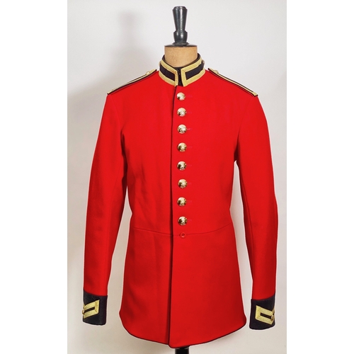 Life Guards Scarlet Tunic.   A very good Elizabeth II period example, of scarlet cloth with dark blue facings. Fitted with bullion edged shoulder straps,  complete with post 1953 anodised buttons and lining with issue label. Scarlet remains bright and fresh.  Near Parade Condition.