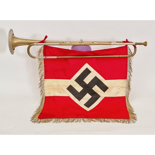German Third Reich Hitler Youth Heraldic Trumpet and Banner.   A good rare brass example with nickel fittings by C.Sattler, Pforheim, approx. 70cm long, complete with detachable mouthpiece. Also complete with double sided red cotton, gold fringed, banner bearing central white horizontal line with applied white diamond printed with black swastika. VGC            Accompanied by original 14th October 1987 Phillips sale catalogue from where the vendor purchased it (lot 351).