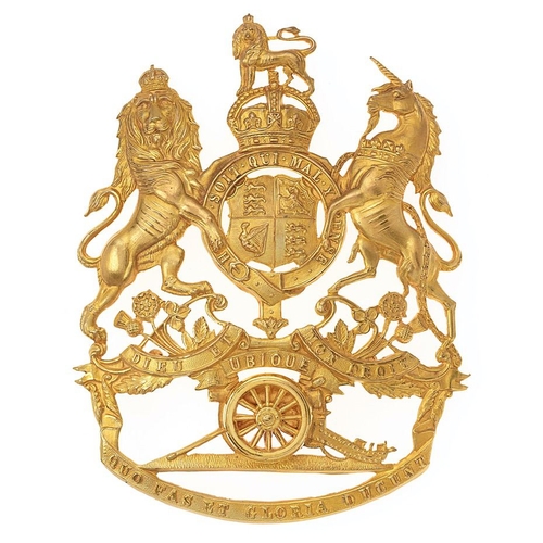 Royal Artillery Officer's helmet plate circa 1901-14. Fine die-stamped gilt Royal Arms, pierced around the shield, with scroll below UBIQUE over a gun with mounted wheel resting on a scroll QUO FAS ET GLORIA DUCUNT. Three loops (one well replaced). VGC