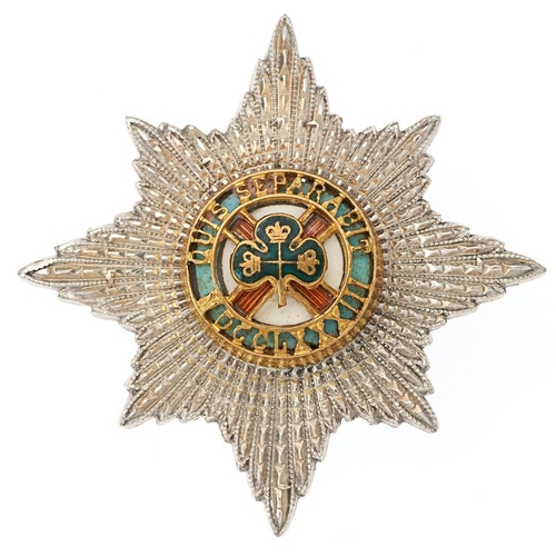 Irish Guards Officer's forage cap badge. Fine silver, gilt and enamelled Star of the Order of St. Patrick Star. Reverse impressed S indicating Sterling silver. VGC