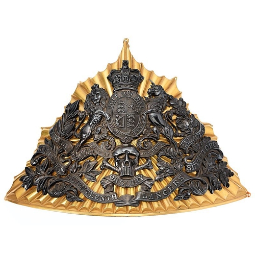 17th Lancers Victorian Officer's lance cap plate circa 1856-60. An extremely fine and scarce example. Triangular, rayed, rich fire gilt plate mounted with the Royal Arms in silver, skull and crossed bones on OR GLORY motto with SEVENTEENTH LANCERS scroll below. Laurel sprays either side bear ALMA INKERMAN BALACLAVA SEVASTOPOL honours. Principal ray points with small holes for sewing to the cap. Silver tarnished to black otherwise VGC Crimean honours granted 16.10.1855. Central India added in 1860. 25.10.1854 took part in the famous Charge of the light Brigade. Gordon Dine Collection.