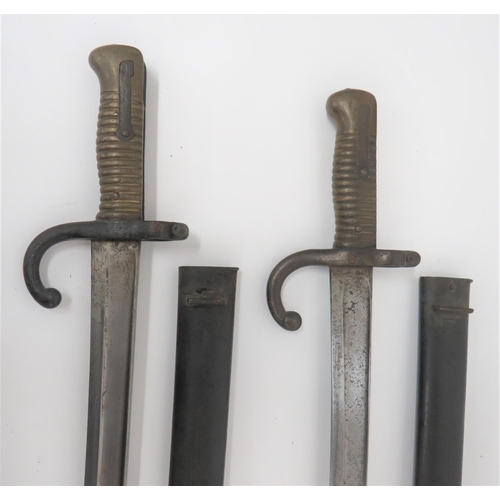 129 - Two French Chassepot Bayonets
22 1/2 inch, single edged, yataghan blade with large fuller.  Spi... 