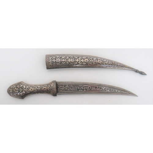 135 - Early 20th Century Indian Knife
5 3/4 inch, double edged blade.  Central, silvered inlaid flora... 