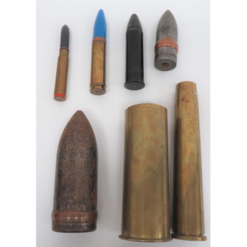 Small Selection of Artillery Shells
including 12 pounder, quick firing, solid steel head ... 3 pounder, solid steel head with tracer cavity ... 7.7 cm, German brass case dated 1915 ... 40 mm, Bofors brass case dated 1953 ... 20 mm, cannon shell and head ... 30 mm, cannon shell and head ... L2A2 1.5 inch baton case and rubber head.  