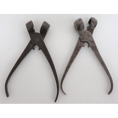 Two Mid 19th Century Steel Bullet Moulds
steel ball pincer moulds.  The arm with central sprue cutter.  One mould stamped "14", the other "16".  2 items.