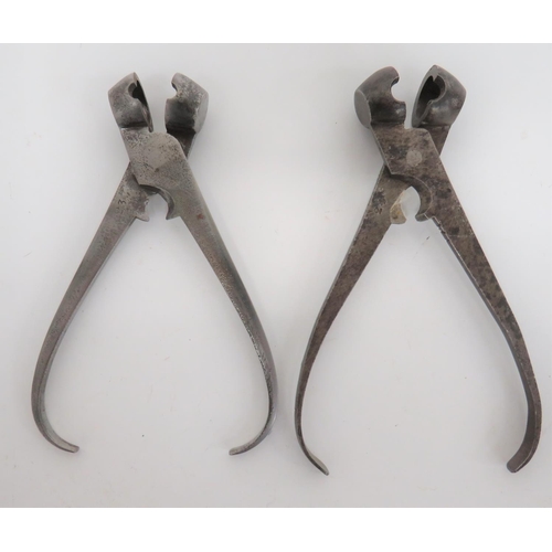 251 - Two Mid 19th Century Steel Bullet Moulds
steel ball pincer moulds.  The arm with central sprue ... 