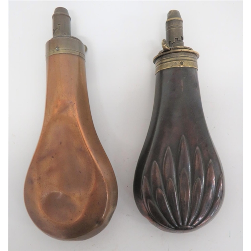 261 - Two Copper and Brass Powder Flasks
consisting darkened copper body with lower floral leaf design. &n... 