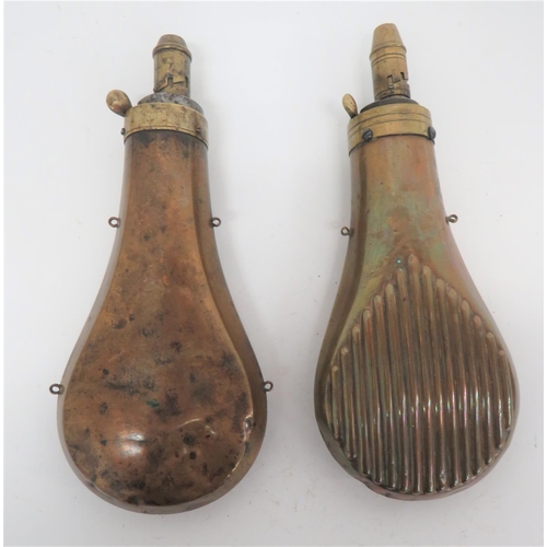 263 - Two Copper and Brass Powder Flasks
consisting copper body with lower reeded panels to both sides.  B... 