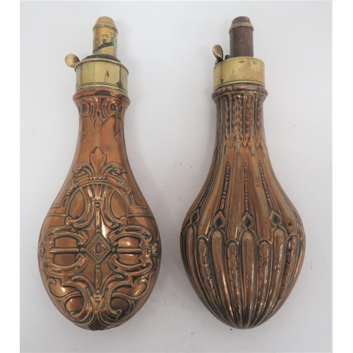 265 - Two Copper and Brass Powder Flasks
consisting copper body with fluted and floral design to both side... 