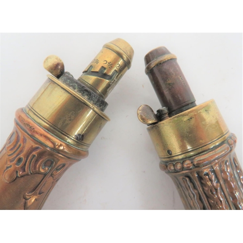 265 - Two Copper and Brass Powder Flasks
consisting copper body with fluted and floral design to both side... 