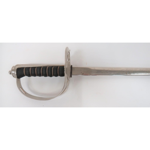 67 - 20th Century Wilkinson English Trade Sword
30 inch, double edged, narrow blade.  Etched English... 