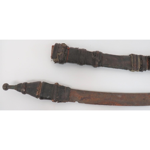 84 - 19th Century African Sword
22 inch, single edged blade with spear point.  Leather covered woode... 