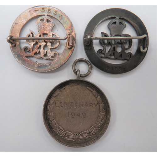 154 - Two WW1 Services Rendered Badges
circular, silver badges.  Rear brooch fitting.  Numbered 