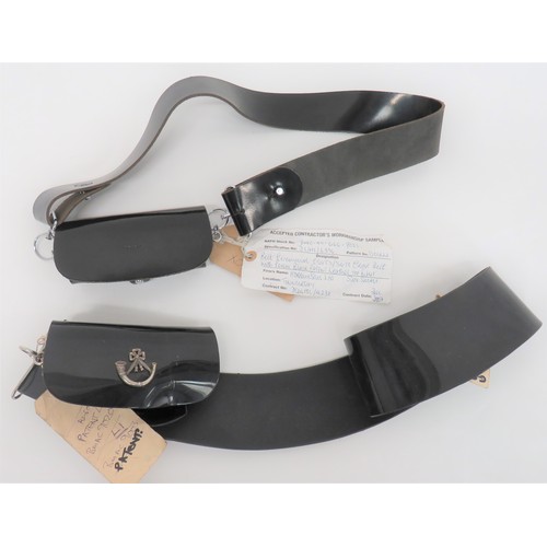 Two Modern Rifles Manufacturer Samples of Cross Belts and Pouches
consisting black composite pouch with full flap.  Silvered strung bugle badge.  Plated joining fitting to one side only.  Black composite cross strap ... Black leather pouch with full flap.  Plated side loop fittings.  Black leather cross strap.  Both complete with manufacturer labels.  2 items.