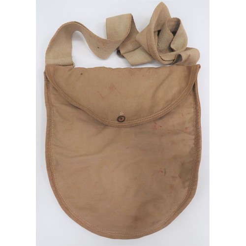 British Issue Side Bag
khaki cotton, semi oval bag.  Top flap secured by small button.  Khaki webbing shoulder strap with brass buckle stamped "T L S".  Interior of flap with broad arrow stamp.  Interior central division. 