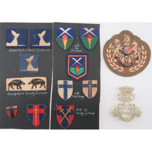 Small Selection of Formation Badges
consisting pair embroidery Aldershot & Hants District ... Pair embroidery Hampshire County Div ... Pair embroidery 46th Div ... Bullion embroidery 1st Army ... Embroidery HQ 21st Army Group. Together with heavy embroidery QC Guards RSM arm badge ... White metal A & SH pouch badge.  15 items.