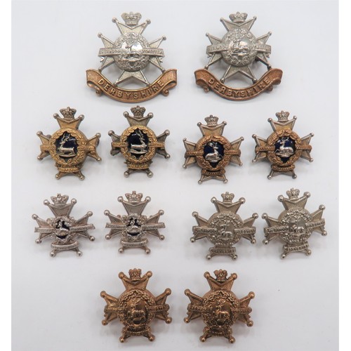 Victorian Derbyshire Cap and Collar Badges
cap consist 2 x bi-metal, Vic crown, lugs.  Collars consist 2 x brass Vic crown ... 2 x white metal Vic crown ... 2 x silvered and enamel  Vic crown ... Facing pair, silvered gilt and enamel Vic crown ... Similar facing pair Vic crown.  12 items. 