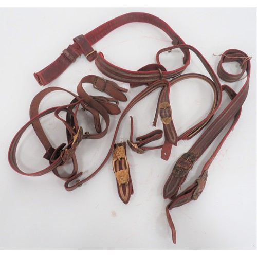 Selection of Officer Sword Belt Parts
maroon leather belt with bullion embroidery lines.  Gilt fittings.  Buckle absent.  5 x matching hanging straps, all with brass lion mask buckles ... Two brown leather hanging straps with plain brass buckles ... Gilt brass, ornate double lion mask buckle.  
