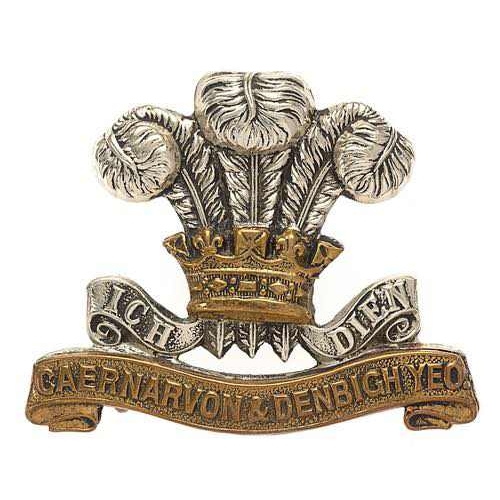 104 - Welsh. Caernarvon & Denbigh Yeomanry cap badge  Good rare white metal Prince of Wales plumes and mot... 