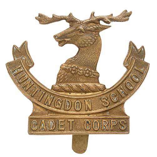 116 - Huntingdon School Cadet Corps cap badge.  Good rare die-stamped brass stag head on title scrolls.   ... 