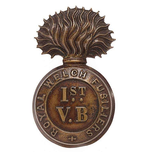 1st (Wrexham) VB Royal Welch Fusiliers cap badge circa 1896-1908.  Good scarce die-stamped bronzed flaming grenade, the ball embossed 1ST /V.B. within ROYAL WELCH FUSILIERS circlet.    Toned loops.  VGC