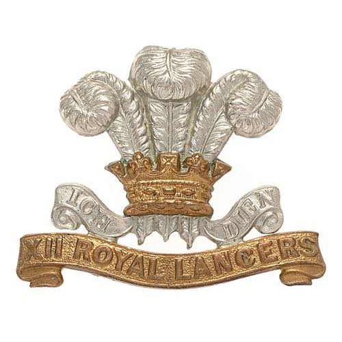 12th Royal Lancers Victorian cap badge circa 1896-1902.  Good scarce die-stamped white metal Prince of Wales plumes and motto with brass coronet resting on brass title scroll.    Three toned loops.  VGC