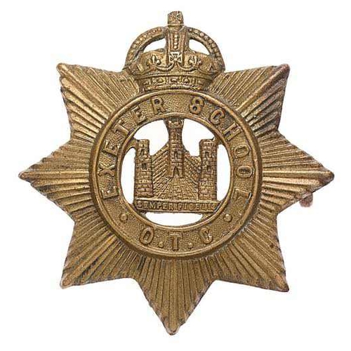 Exeter School OTC cap badge circa 1908-40.  Good scarce die-stamped brass issue of Devonshire Regiment pattern with EXETER SCHOOL OTC circlet. (KK 2553)    Loops  VGC