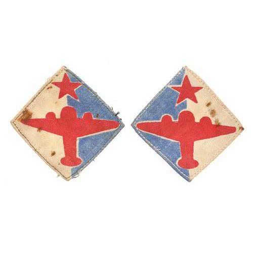 Indian Air formation sign badgeals WW2 facing pair of formation sign badges.  Good scarce examples. Each beaing a star and aeroplane printed  on blue and white vertically divided diamond. (2 items)      Removed from uniform. Stained.