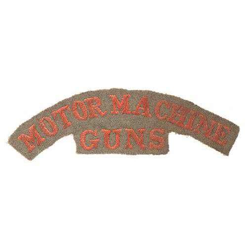 418 - MOTOR MACHINE / GUNS WW1 cloth shoulder title badge.  Good rare red serif letters embroidered on kha... 