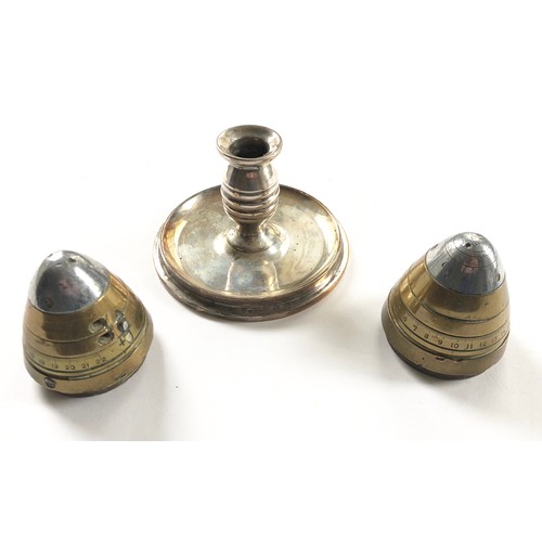 172 - WW1 Trench Art Candlestick and Fuse Caps.Comprising: a candlestick made from the base of a 1917 4.5 ... 