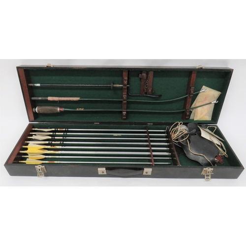Late 20th Century Apollo Falcon Long Bow
green painted steel, recurve bow with alloy end tips.  Central cork handgrip.  Complete with 13 x steel tipped, alloy arrows with feather flights.  All contained in a fitted wooden case.  
