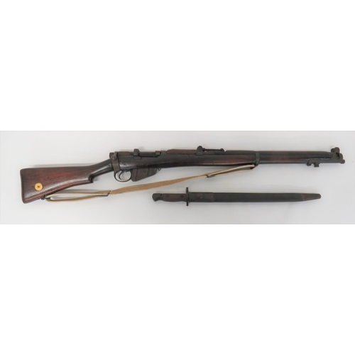 Deactivated 1916 Dated SMLE MKIII Rifle
.303, 25 1/4 inch barrel.  Top mounted leaf sight.  Action with slot for single shot lever.  Rear body with maker stamp "BSA & Co" dated 1916.  Turn down bolt handle.  Blackened steel trigger guard and removable magazine.  Polished wooden butt with brass butt disk and butt plate.  Polished, three section woodwork.  Steel barrel band and nose cap.  Webbing rifle sling. Matching bayonet complete with its steel mounted leather scabbard.  Complete with current deactivation certificate.  