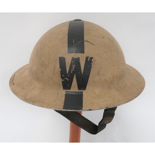 1938 Dated Warden's Steel Helmet
white overpainted crown with black central line and W to the front and rear.  Inner brim painted black.  Black treated linen liner with fibre cruciform dated 1938 and early pattern, oval rubber crown pad.  Sprung webbing chinstrap. 
