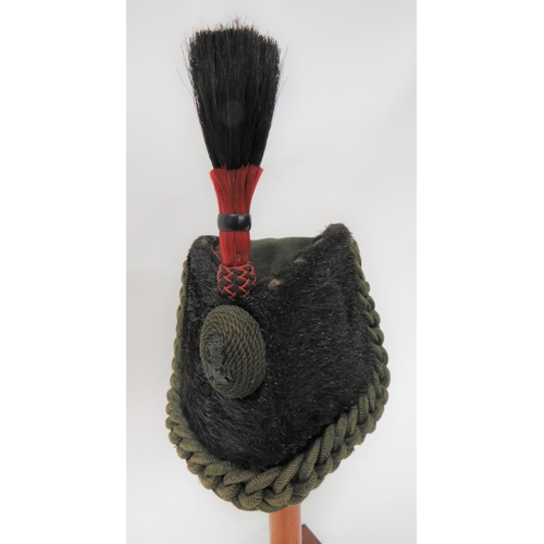 304 - Victorian Rifles Other Ranks Sealskin Cap
dark green felt crown.  Black sealskin body with green pla... 