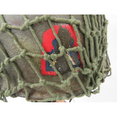 312 - Post November 1944 American M1 Helmet
dark green, rough texture shell with spray areas of light gree... 