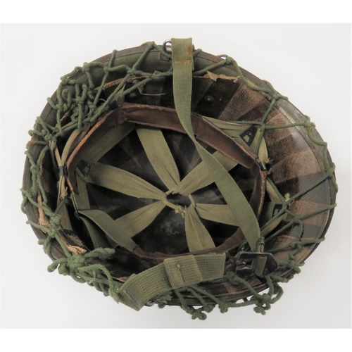 312 - Post November 1944 American M1 Helmet
dark green, rough texture shell with spray areas of light gree... 