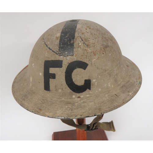 318 - 1940 Dated Senior Fire Guard MKII Steel Helmet
white overpainted black outer shell leaving a central... 