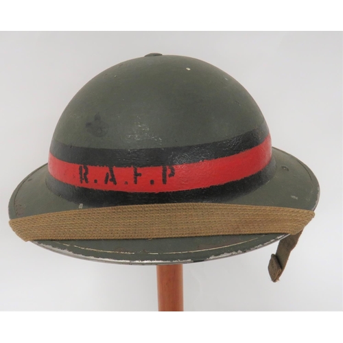 322 - 1943 Dated RAFP MKII Steel Helmet
green painted crown. &nbsp;Black and red crown band with RAFP to t... 