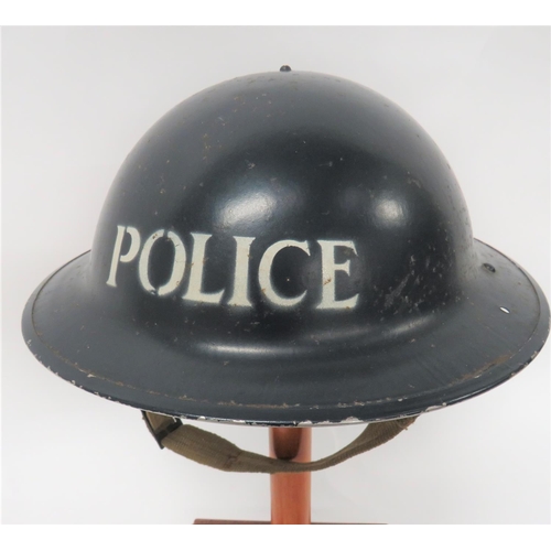 324 - 1940 Dated Police MKII Steel Helmet
blue painted crown. &nbsp;The front with white stencilled 