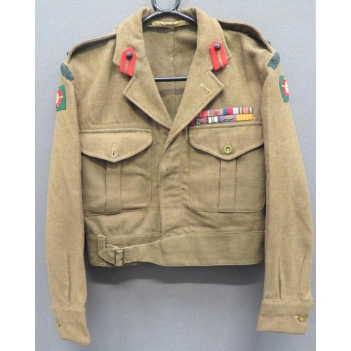 1949 Pattern 10th Gurkha Rifles Staff Brigadier Battle Dress Jacket
khaki woollen, single breasted, open collar, short jacket with lower extended belt.  Pleated chest pockets with buttoned flaps.  Collar with red Staff Officer tabs.  Shoulder straps with blackened KC Brigadier ranking.  Both arms with embroidery 10th Gurkha Rifles titles over embroidery Catterick District formation badges.  Medal ribbons to the left chest include OBE, DSO and bar.  WW2 medals, GSM with oak leaf.  Internal issue with faint date.  
Attributed to Major (temp Lt Col) David Drummond Maurice McCready 10th Gurkha Rifles Indian Army.  OBE awarded 1949.  