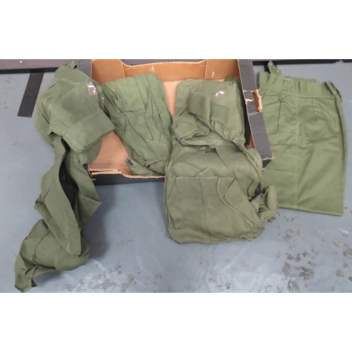Selection of Post War Jungle Green Bush Shirts
3 x green Aertex, single breasted shirts.  Pleated chest pockets. Two complete with Gurkha formation badges ... 2 x green cotton issue trousers.  5 items.
