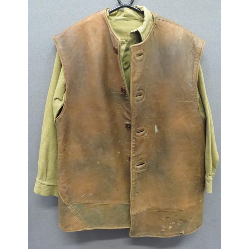 351 - 1941 Dated Leather Jerkin
brown leather, multi panel, single breasted, sleeveless jerkin.  The front... 